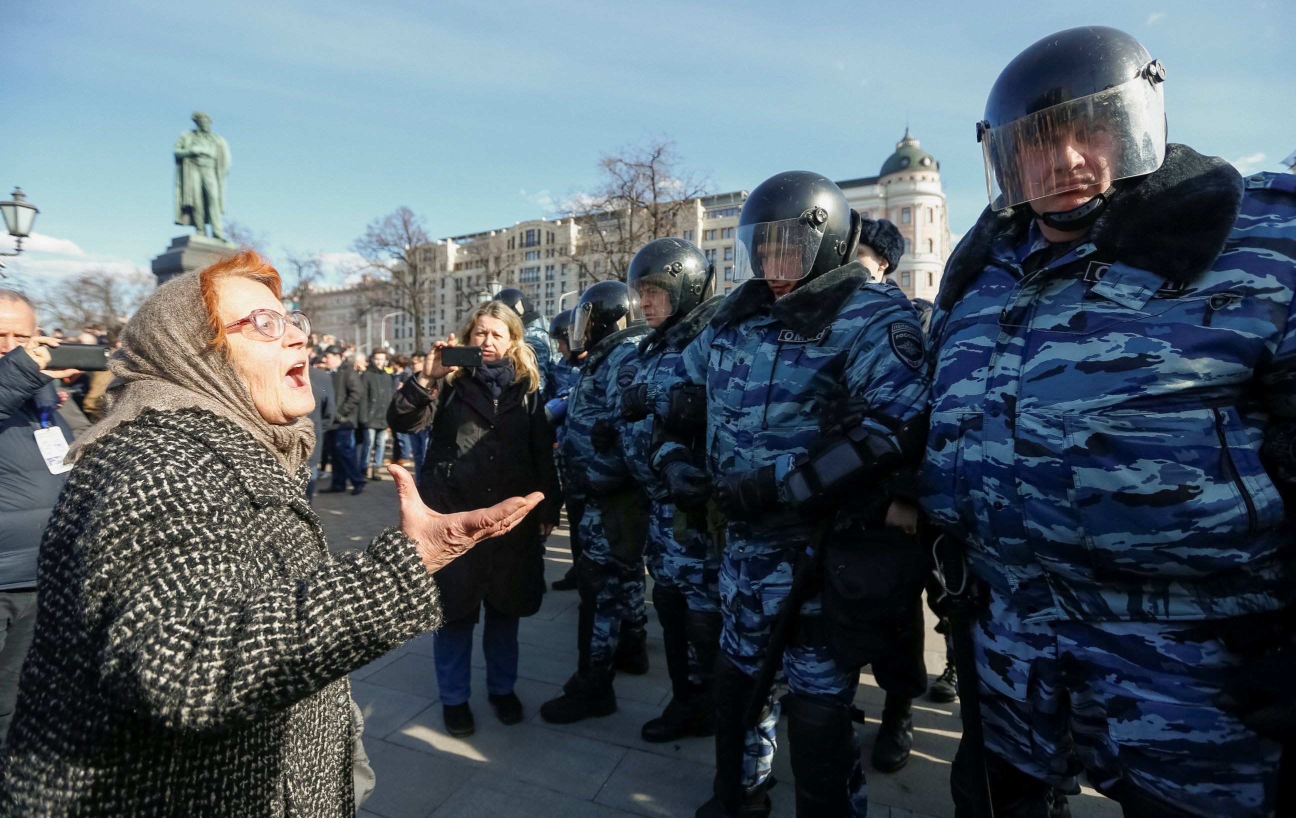 PHOTO: A woman argues with law enforcement officers as they block a rally in Moscow, Russia, March 26, 2017. 
