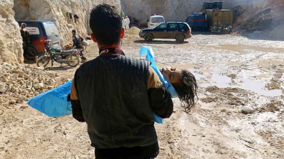 PHOTO: A man carries the body of a dead child after what rescue workers described as a suspected gas attack in the town of Khan Sheikhoun in rebel-held Idlib, Syria, April 4, 2017.