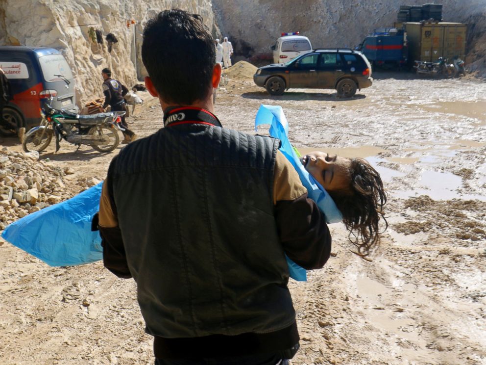 PHOTO: A man carries the body of a dead child after what rescue workers described as a suspected gas attack in the town of Khan Sheikhoun in rebel-held Idlib, Syria, April 4, 2017.