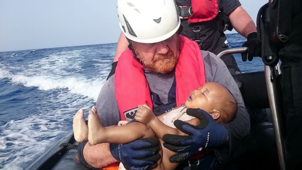 PHOTO: German rescuer from the humanitarian organization Sea-Watch holds a drowned migrant baby, off the Libyan coast on May 27, 2016.