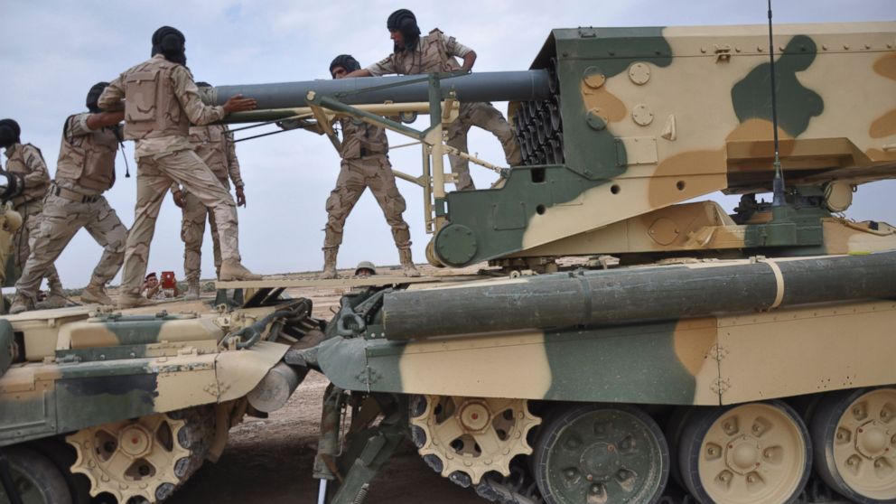 Iraqi Army soldiers work in a Russian-made multiple rocket launcher known as the TOS-1A during training at a military camp in Baghdad, Oct. 14, 2014.