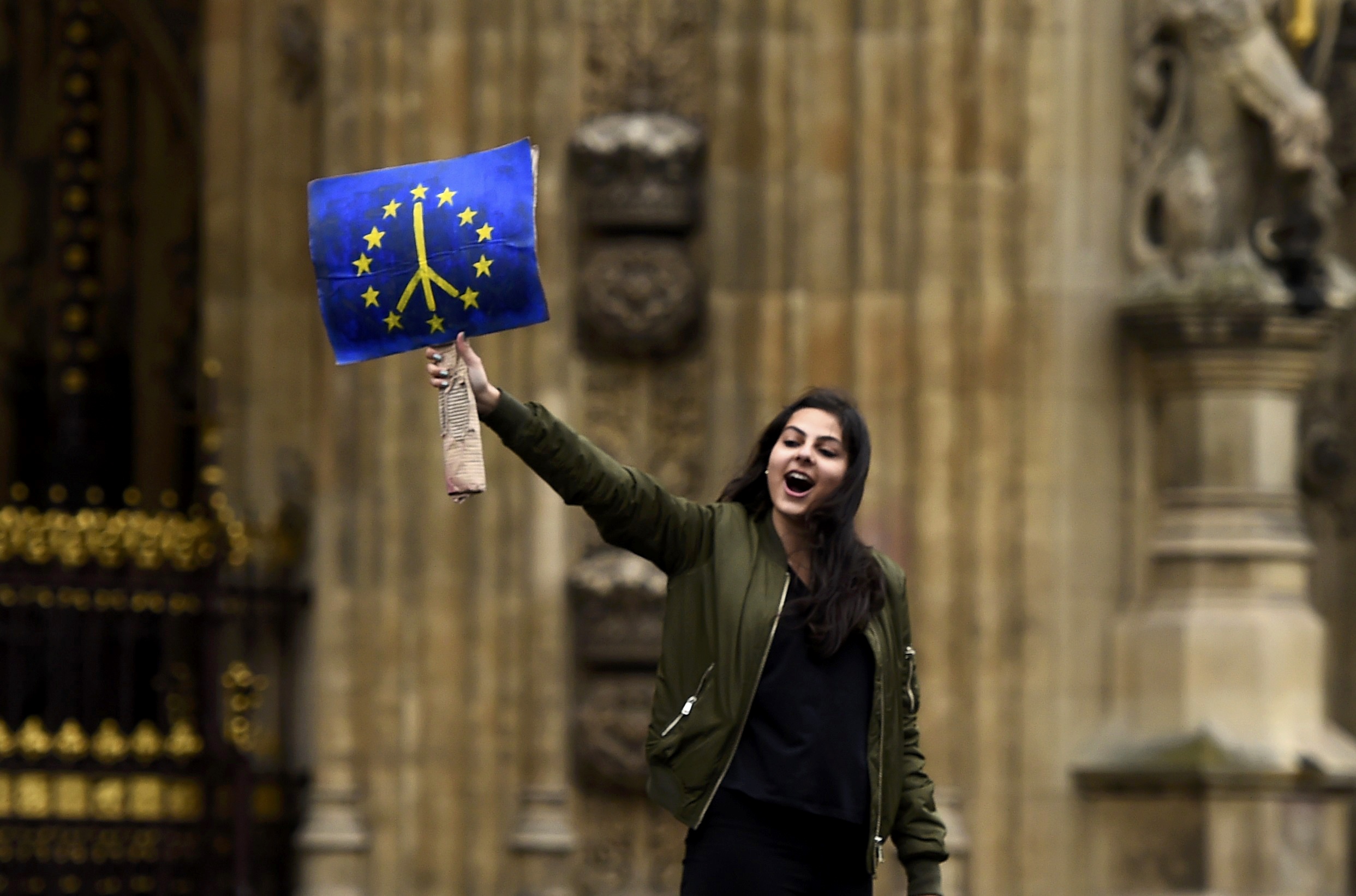 PHOTO: A demonstrator stands outside the Houses of Parliament during a protest aimed at showing London's solidarity with the European Union in London, June 28, 2016.