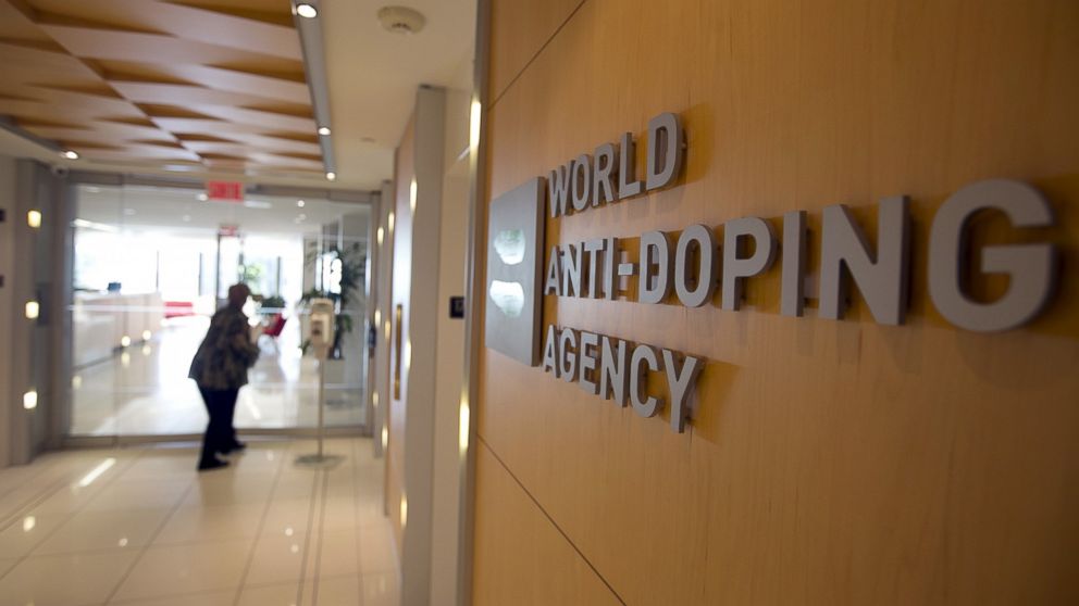 A woman walks into the head office for the World Anti-Doping Agency (WADA) in Montreal, Quebec, on Nov. 9, 2015. 
