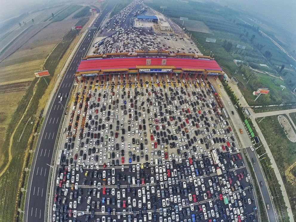 PHOTO: Vehicles are seen stuck in a traffic jam near a toll station as people return home at the end of a week-long national day holiday, in Beijing, Oct. 6, 2015.