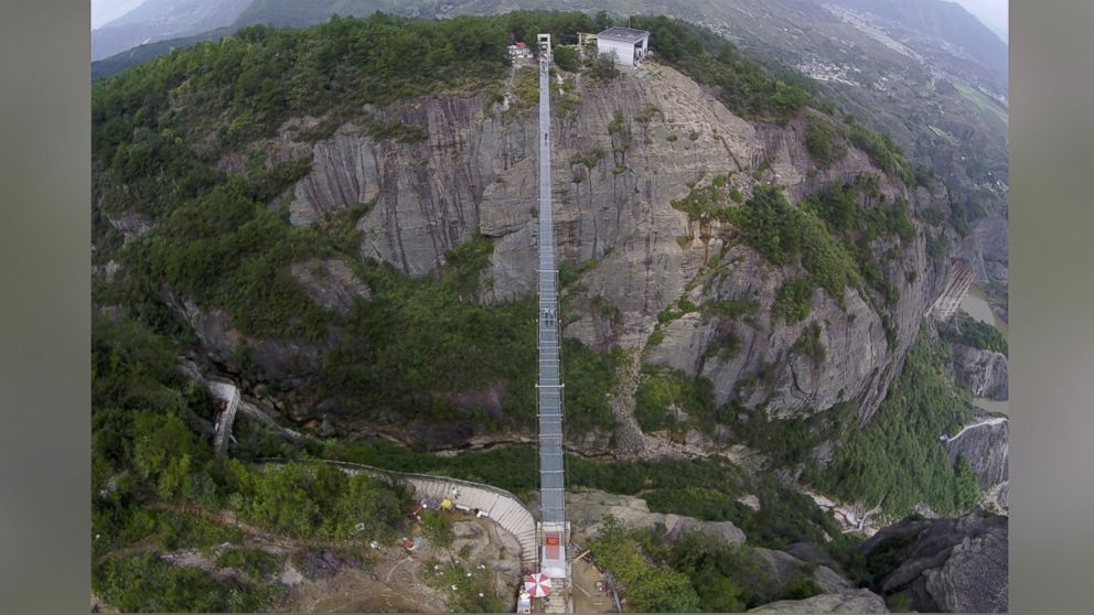 PHOTO: An aerial view shows a glass suspension bridge at the Shiniuzhai National Geo-park in Pinging county, Hunan province, China, Sept. 24, 2015. 