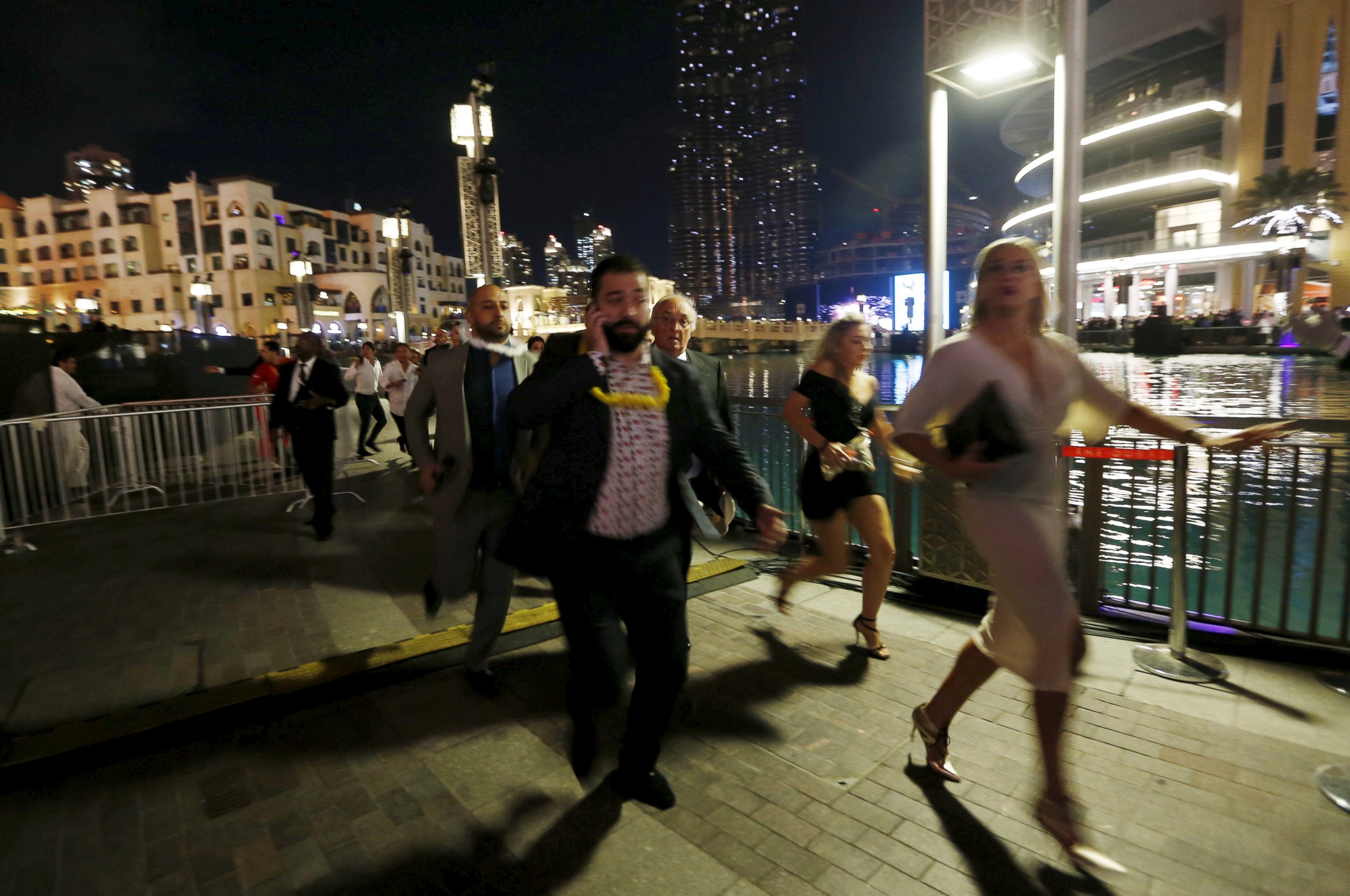 PHOTO: People run away as a  fire engulfs The Address Hotel in downtown Dubai in the United Arab Emirates Dec. 31, 2015.