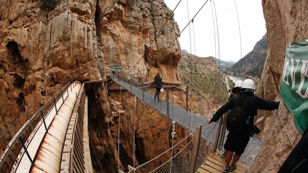 Journalists take pictures as they walk along the new Caminito del Rey (The King's Little Pathway) in El Chorro-Alora, near Malaga, southern Spain March 15, 2015. 
