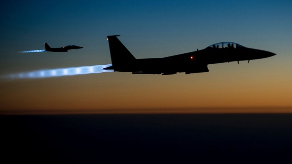 This file handout photo shows a pair of U.S. Air Force F-15E Strike Eagles flying over northern Iraq, Sept. 23, 2014. 