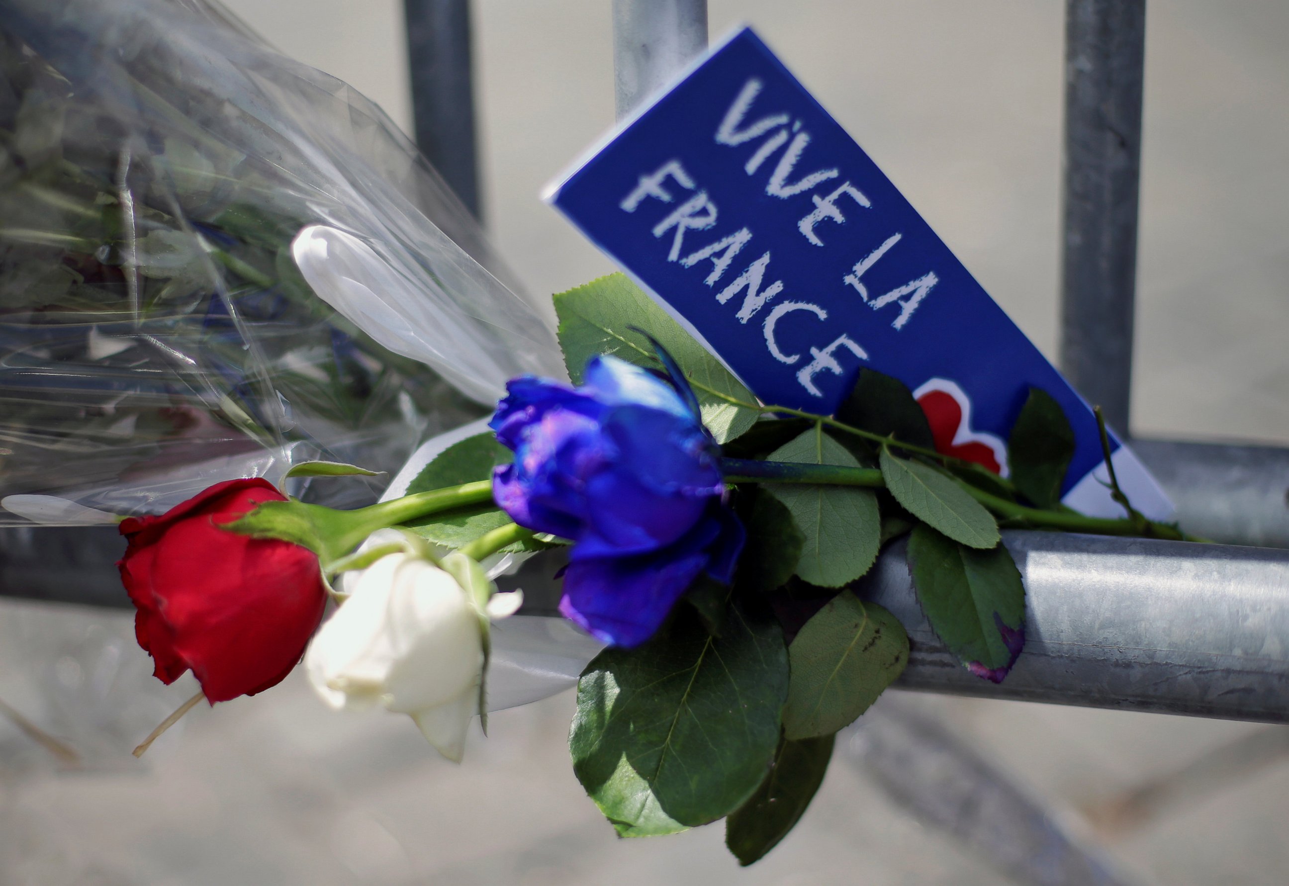 PHOTO: Flowers are seen attached to a fence to remember the victims of the Bastille Day truck attack in Nice in front of the French embassy in Rome, July 15, 2016.