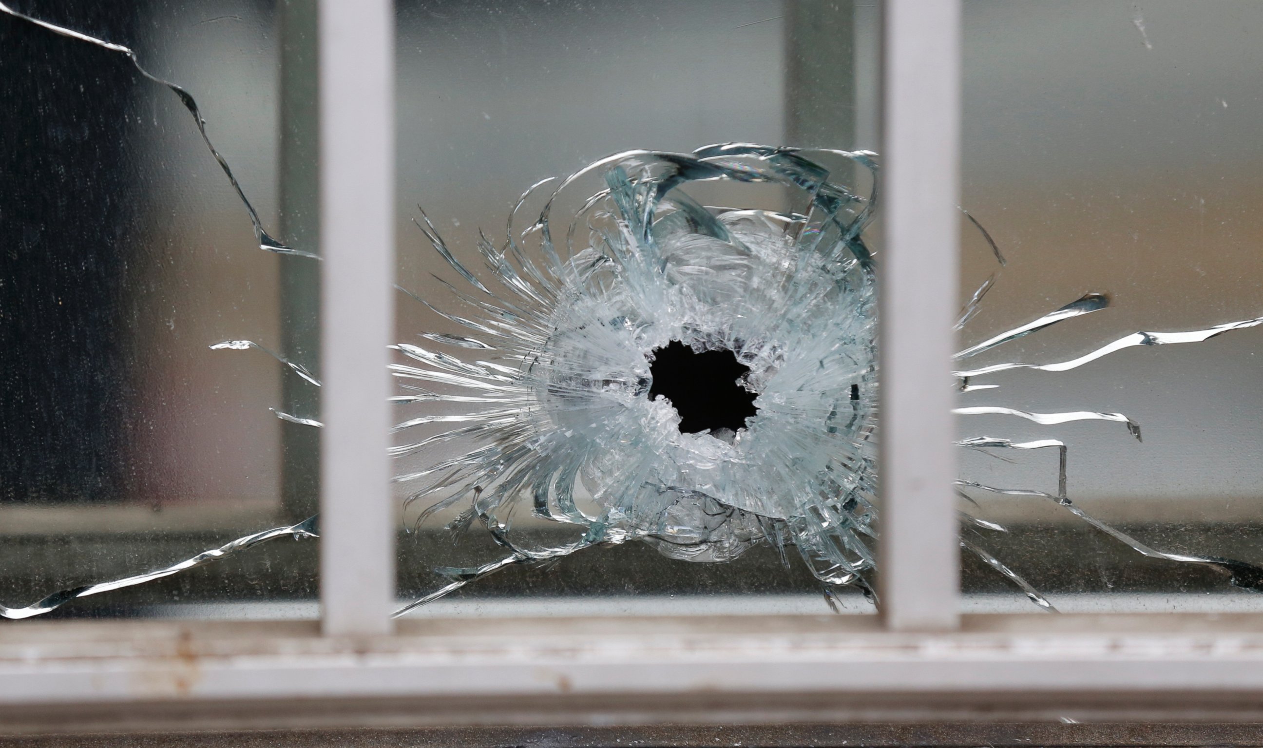 PHOTO: A bullet's impact is seen on a window at the scene after a shooting at the Paris offices of Charlie Hebdo, a satirical newspaper, Jan. 7, 2015. 