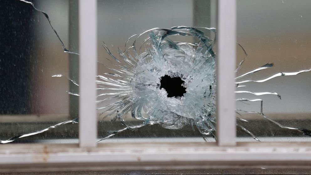 PHOTO: A bullet's impact is seen on a window at the scene after a shooting at the Paris offices of Charlie Hebdo, a satirical newspaper, Jan. 7, 2015. 