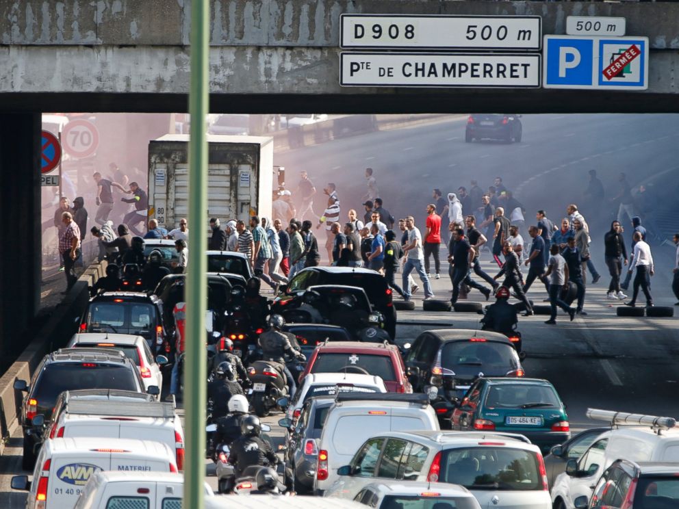 PHOTO: French taxi drivers, who are on strike, block the traffic on the Paris ring road during a national protest against car-sharing service Uber, in Paris, June 25, 2015.