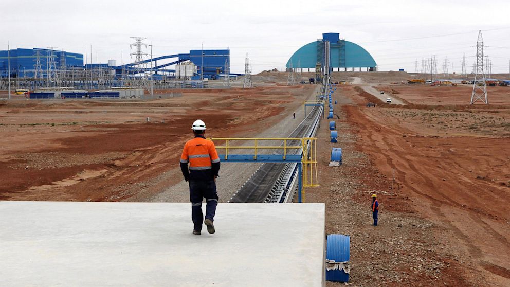 An employee looks at the Oyu Tolgoi mine in Mongolia's South Gobi region, June 23, 2012. 