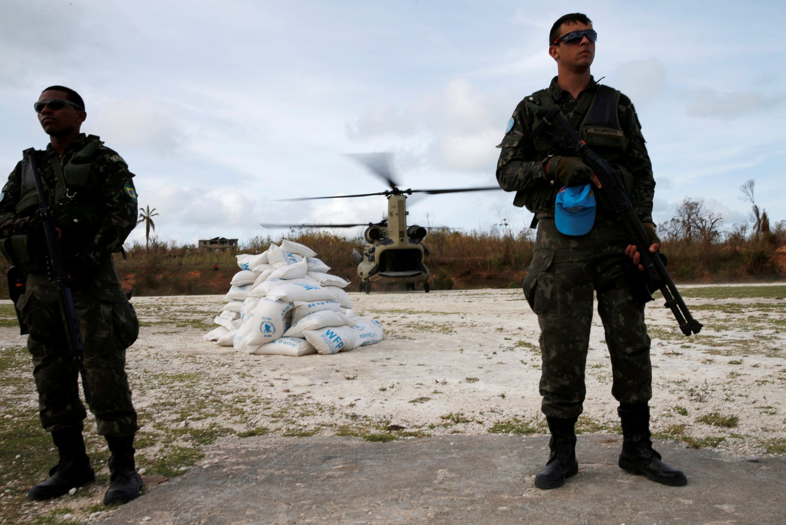 PHOTO: U.N. peace keepers stand guard near relief aid after Hurricane Matthew passes in Jeremie, Haiti, Oct. 9, 2016.