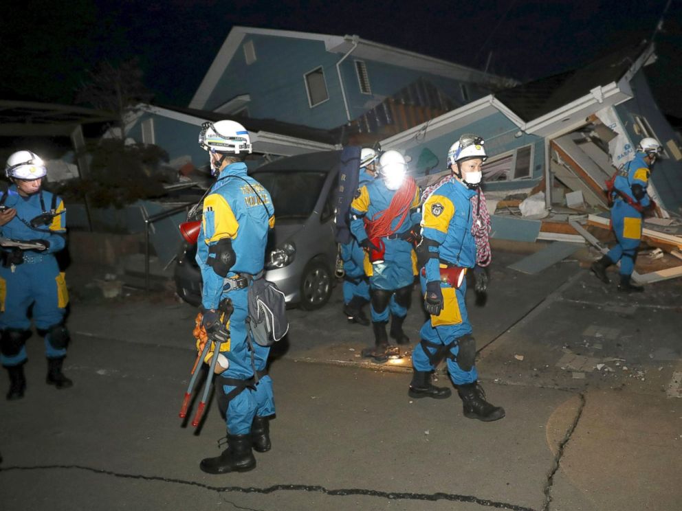 PHOTO: Police officers check a collapsed house after an earthquake in Mashiki town, Kumamoto, Japan, April 16, 2016.