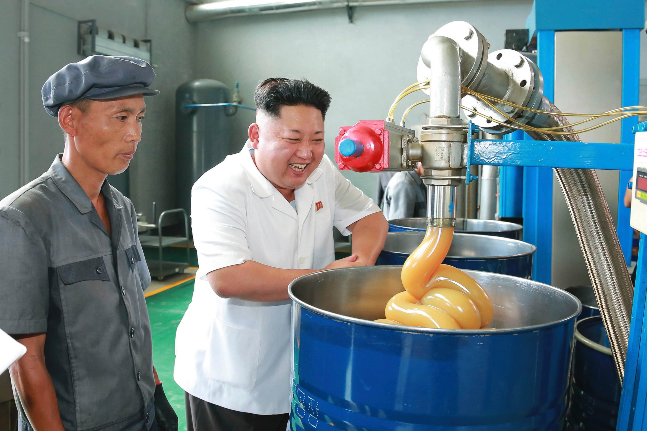 PHOTO: North Korean leader Kim Jong Un smiles during a visit to the Chonji Lubricant Factory, in this undated photo released by North Korea's Korean Central News Agency in Pyongyang on Aug. 6, 2014. 