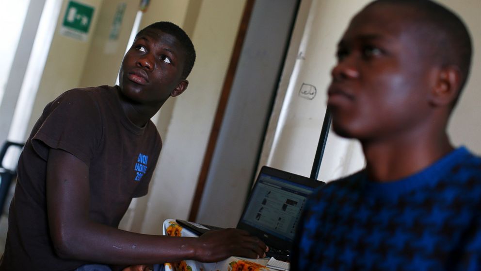 Ebrima Sanneh, 17, from Gambia uses a laptop at an immigration centre in the Sicilian town of Caltagirone, Italy, April 22, 2016. Sanneh arrived in Italy this year by boat from Libya. "They rob you and take your money, or if they see you have no money on you, they kill you," he said.