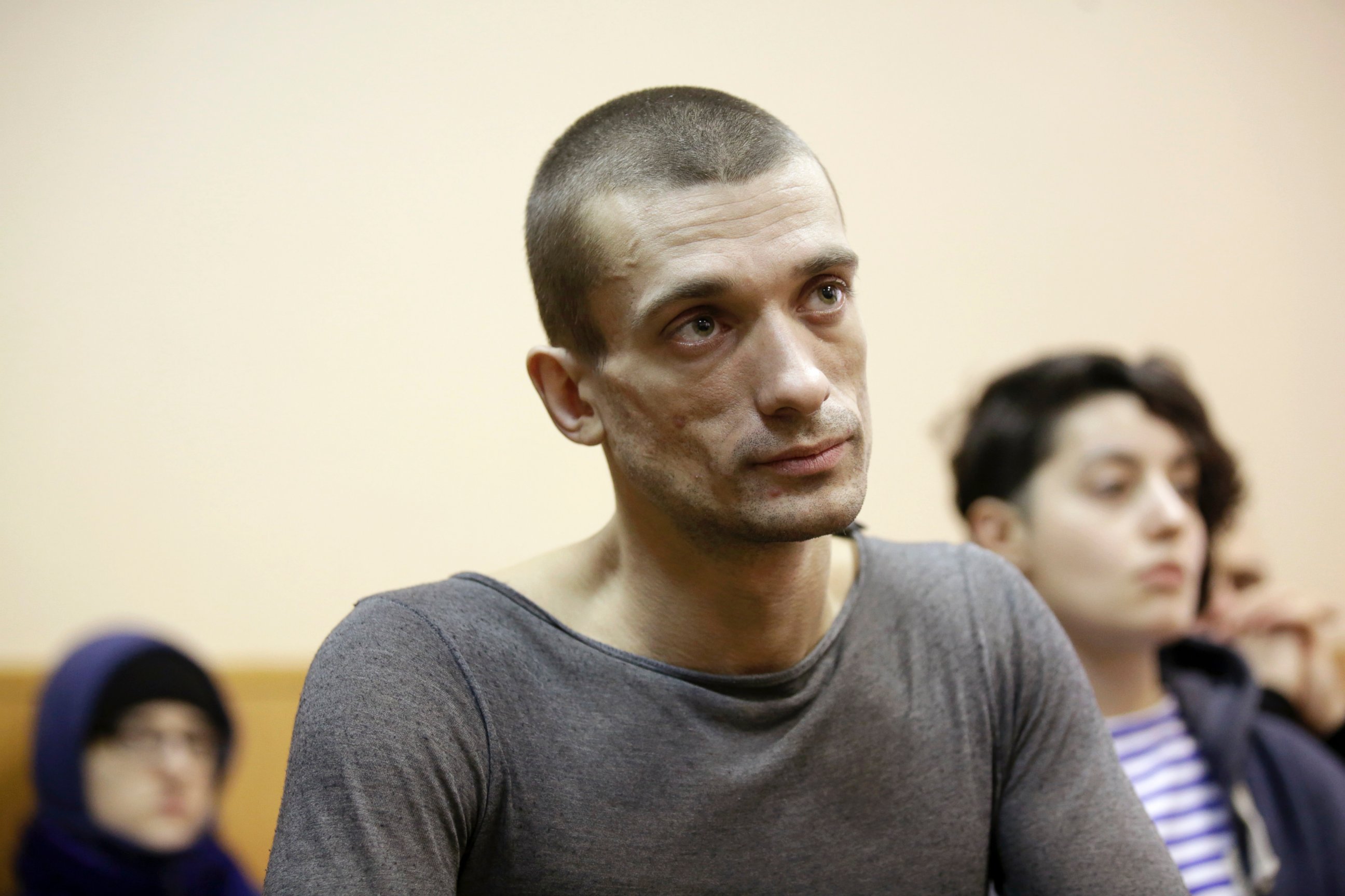 PHOTO: Artist Pyotr Pavlensky listens during a hearing at a Russian courthouse in St.Petersburg, Russia, Feb. 24, 2014.