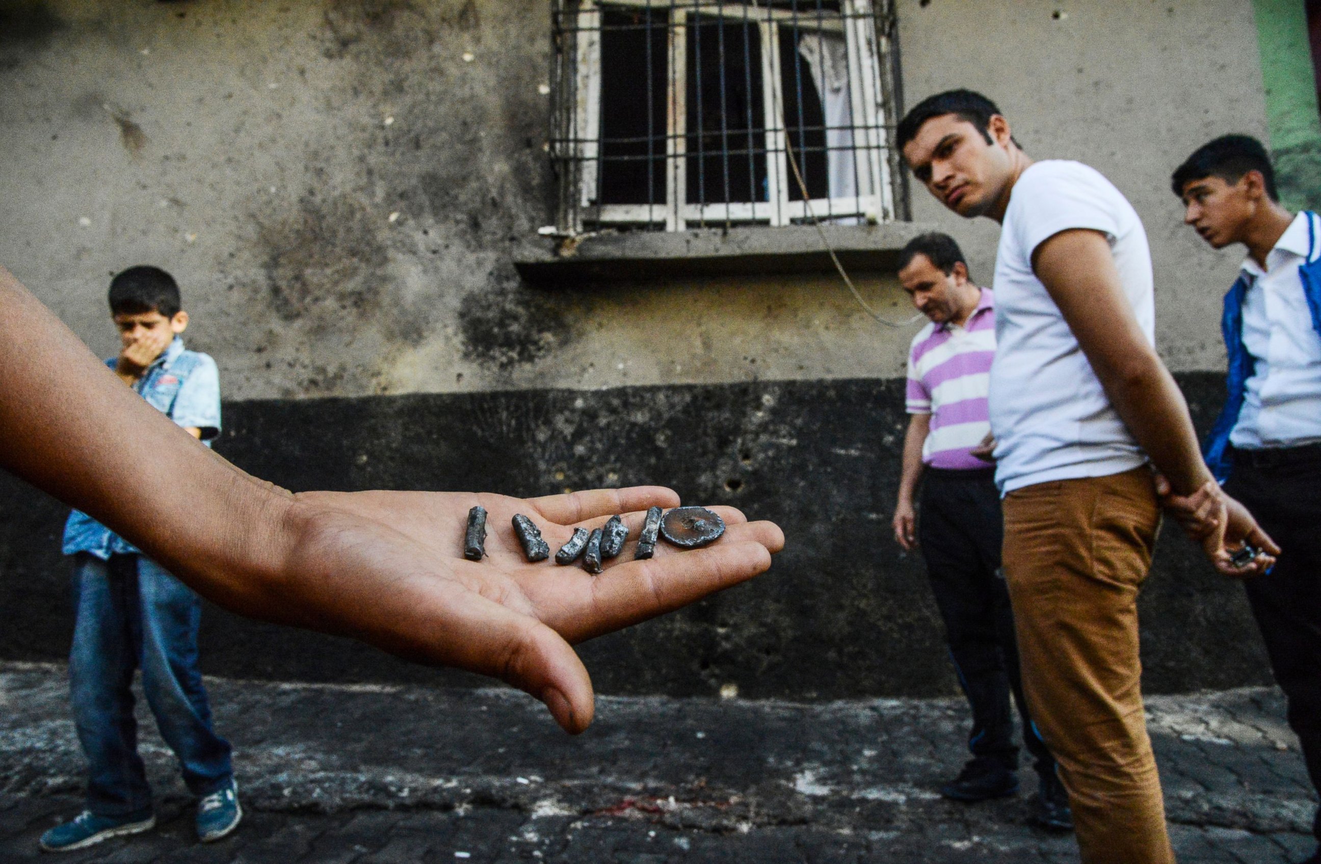PHOTO: A person shows pieces of projectile near the explosion scene following a late night attack on a wedding party that left at least 30 dead in Gaziantep in southeastern Turkey near the Syrian border, Aug. 21, 2016. 
