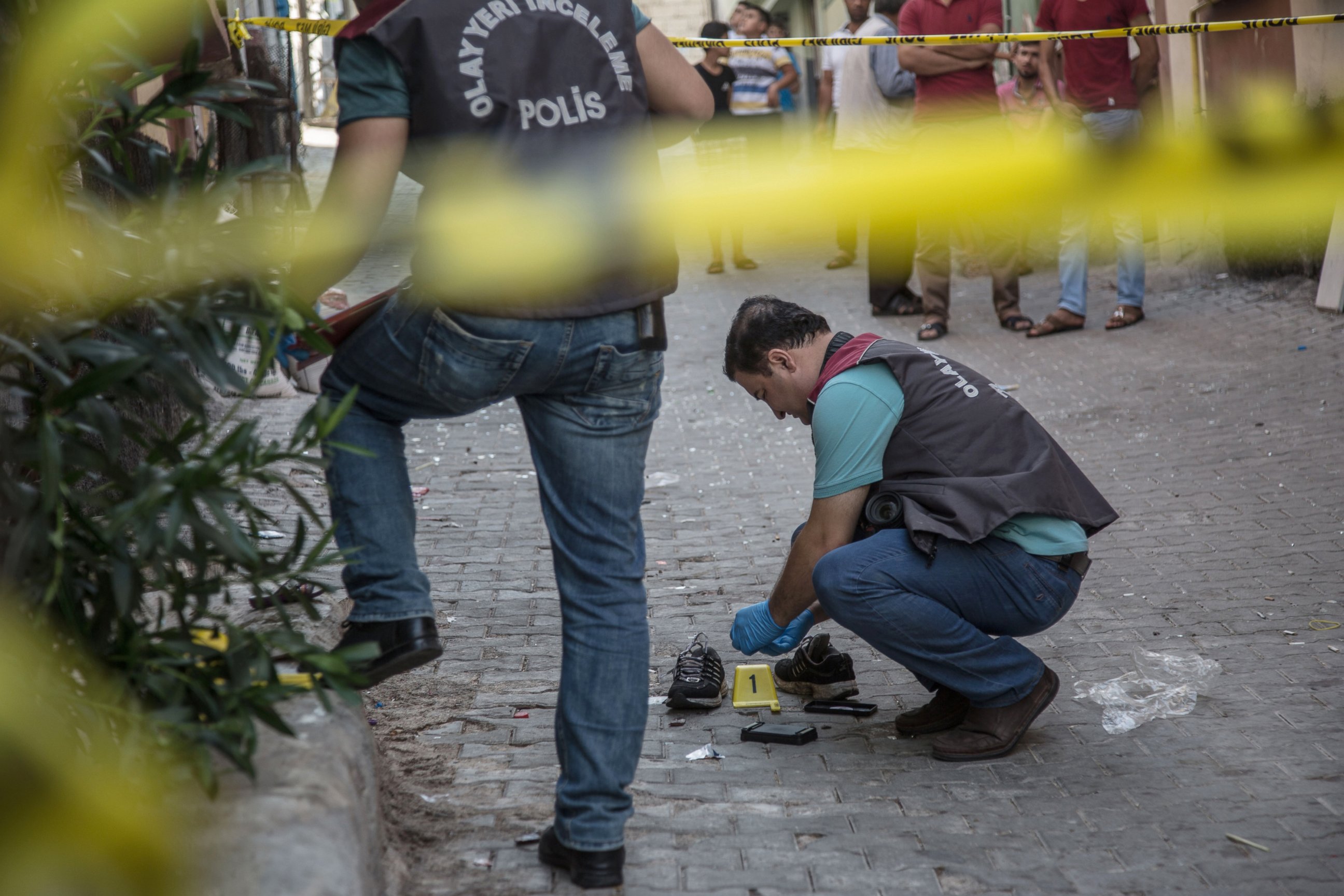PHOTO: Turkish police work near the explosion scene following a late night attack on a wedding party that left at least 30 dead in Gaziantep in southeastern Turkey near the Syrian border, Aug. 21, 2016. 
