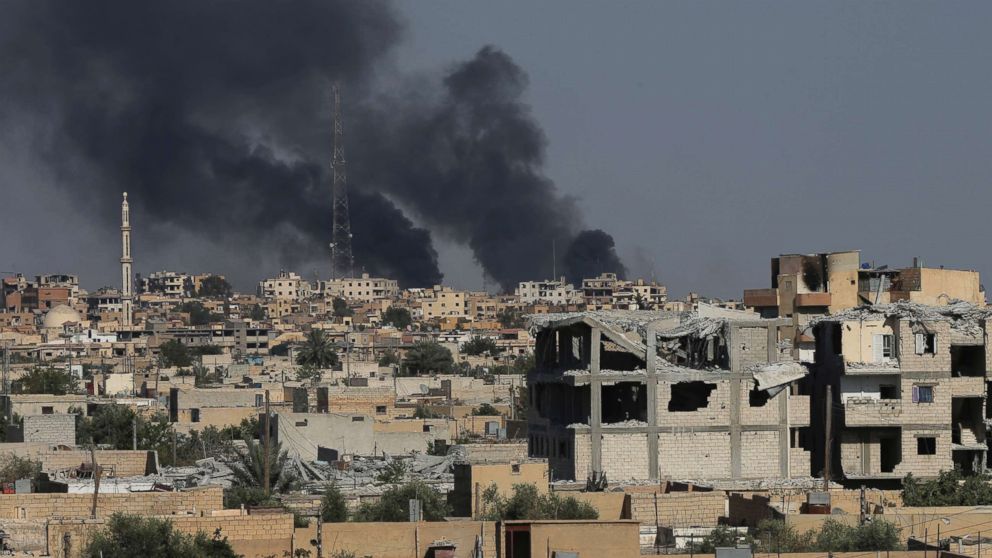 PHOTO: Black smoke rises from Raqqa city where U.S.-backed Syrian Democratic Forces fighters battle against the Islamic State militants, in Raqqa, northeast Syria, July 27, 2017.
