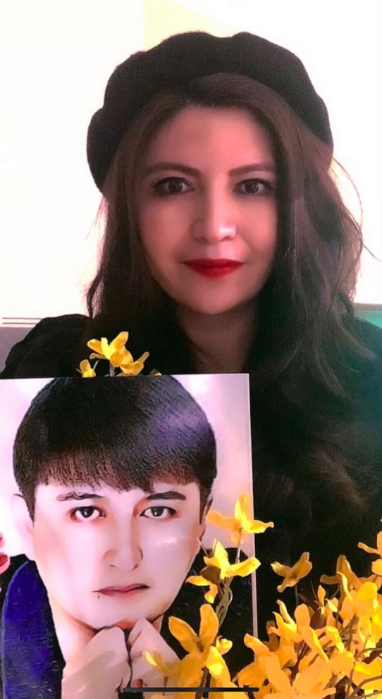 PHOTO: Rayhan Asat pictured here with a photo of her incarcerated brother, Ekpar Asat. He may face 15 years in a Chinese prison on vague charges. 
