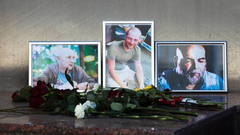 PHOTO: Flowers are placed by portraits of slain journalists Alexander Rastorguyev, Kirill Radchenko and Orkhan Dzhemal, at the Russian journalists Union building in Moscow, Aug. 1, 2018. 