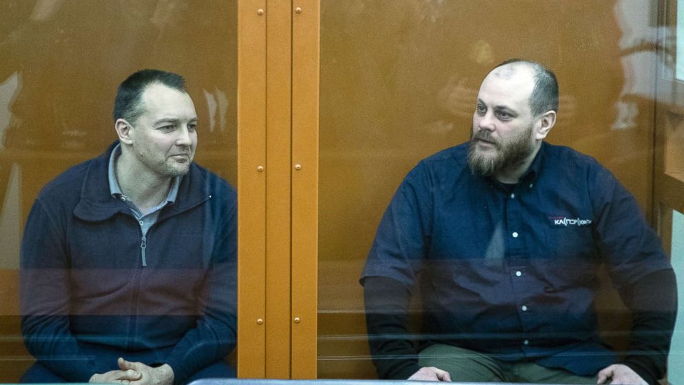 The former chief of the cybercrime department at Russia's main domestic security agency Sergei Mikhailov, left, and the former employee of Kaspersky Lab cybersecurity firm Ruslan Stoyanov attend a hearing in a court in Moscow, Russia, Feb. 26, 2019.