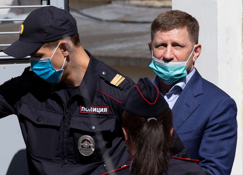 PHOTO: A governor of the Khabarovsk region along the border with China, Sergei Furgal, right, is escorted from a court room in Moscow, Russia, Friday, July 10, 2020. 