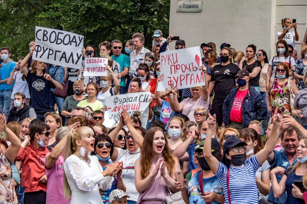 PHOTO: People hold posters reading "Freedom for Sergei Furgal and Hands off from Sergei Furgal!" during an unsanctioned protest in support of Sergei Furgal, the governor of the Khabarovsk region in Khabarovsk, on Saturday, July 11, 2020. 