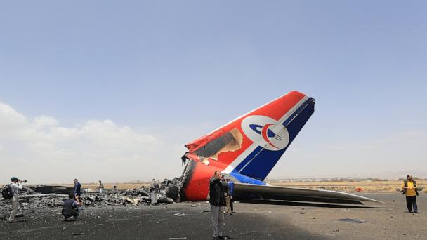 Journalists inspect a destroyed plane on the tarmac at the Sana'a International Airport in Yemen on May 7, 2025, after Israeli strikes there.