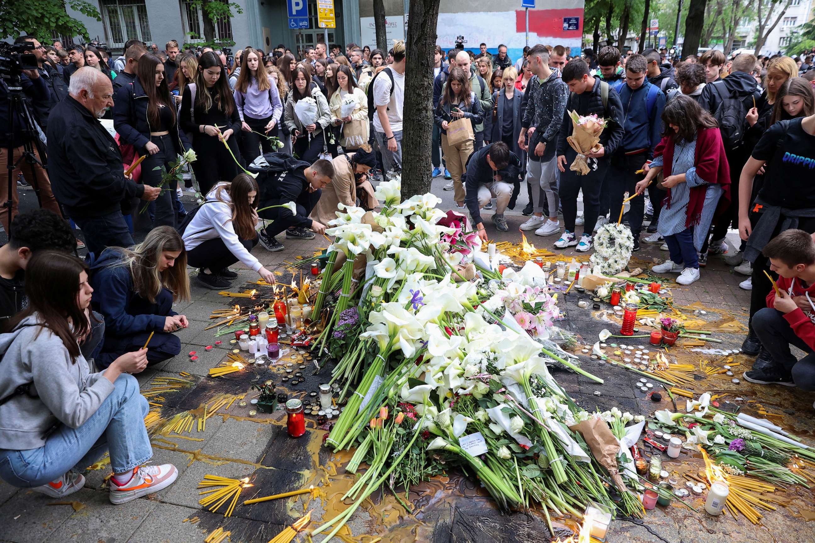 PHOTO: People pay tribute following a school mass shooting, after a boy opened fire on others, killing fellow students and staff, in Belgrade, Serbia, May 4, 2023.