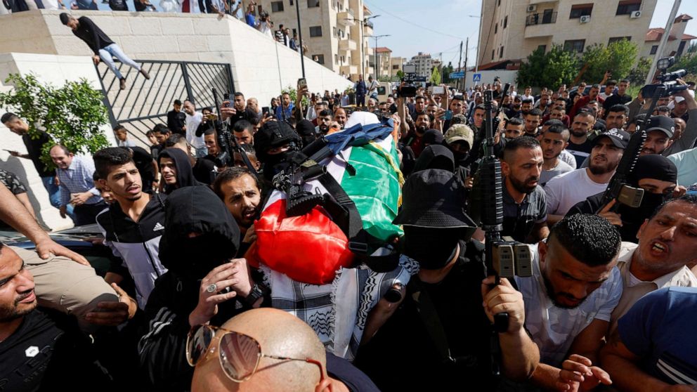 PHOTO: Palestinians carry the body of Al Jazeera reporter Shireen Abu Akleh in Jenin in the Israeli-occupied West Bank, May 11, 2022.