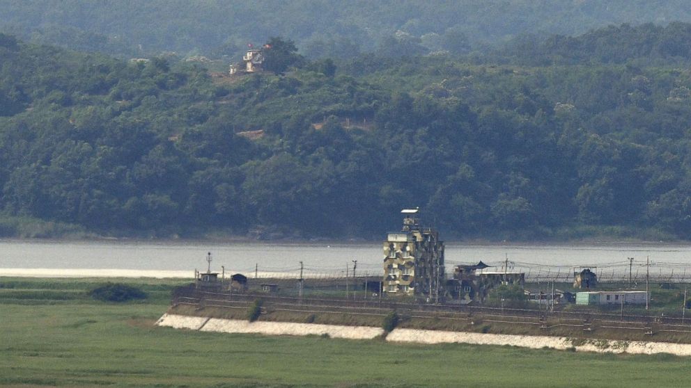 PHOTO: Military guard posts of South Korea (bottom R) and North Korea (top L) stand opposite each other as seen from a South Korean observation post in the border city of Paju on June 17, 2020. 