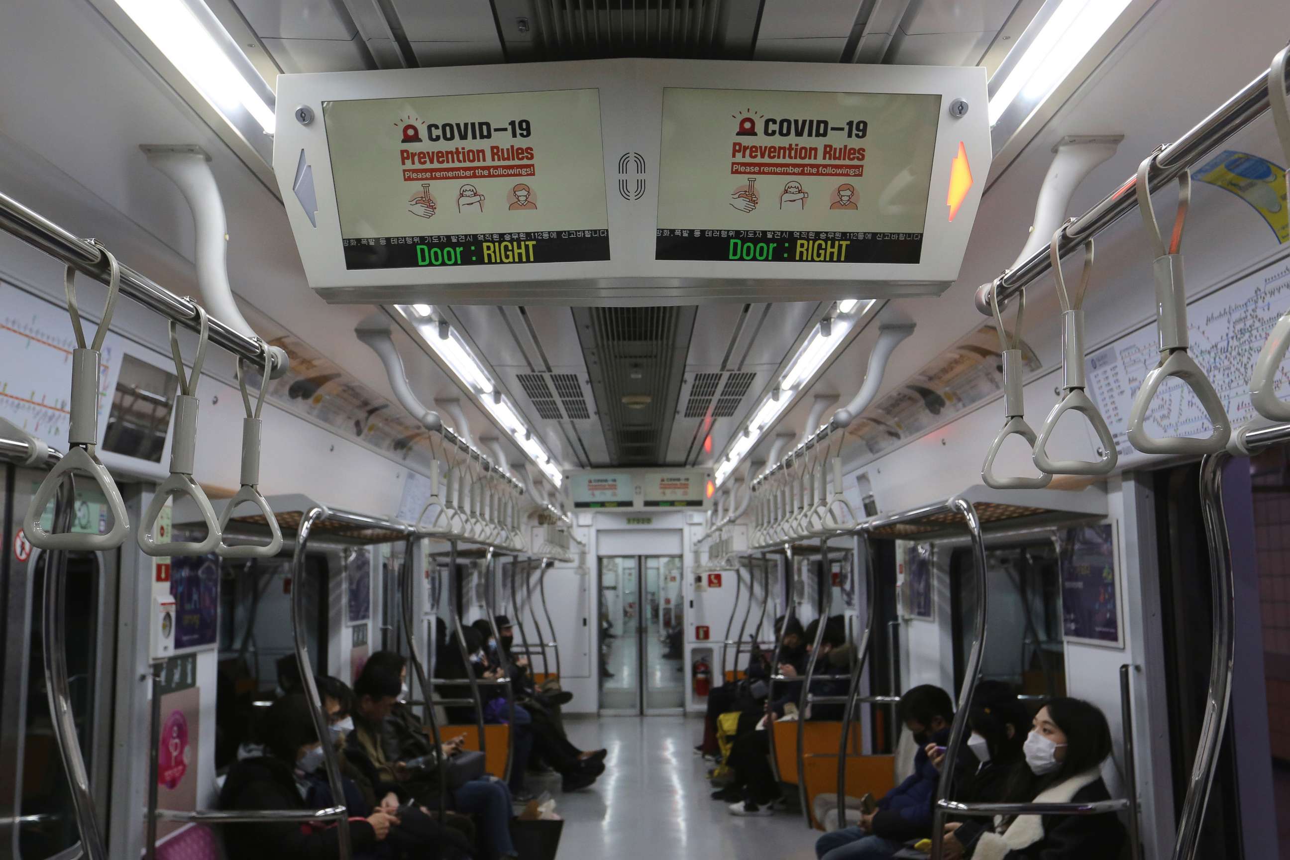 PHOTO: Electric screens about precautions against the illness COVID-19 are seen in a subway train in Seoul, South Korea, Sunday, Feb. 23, 2020. 