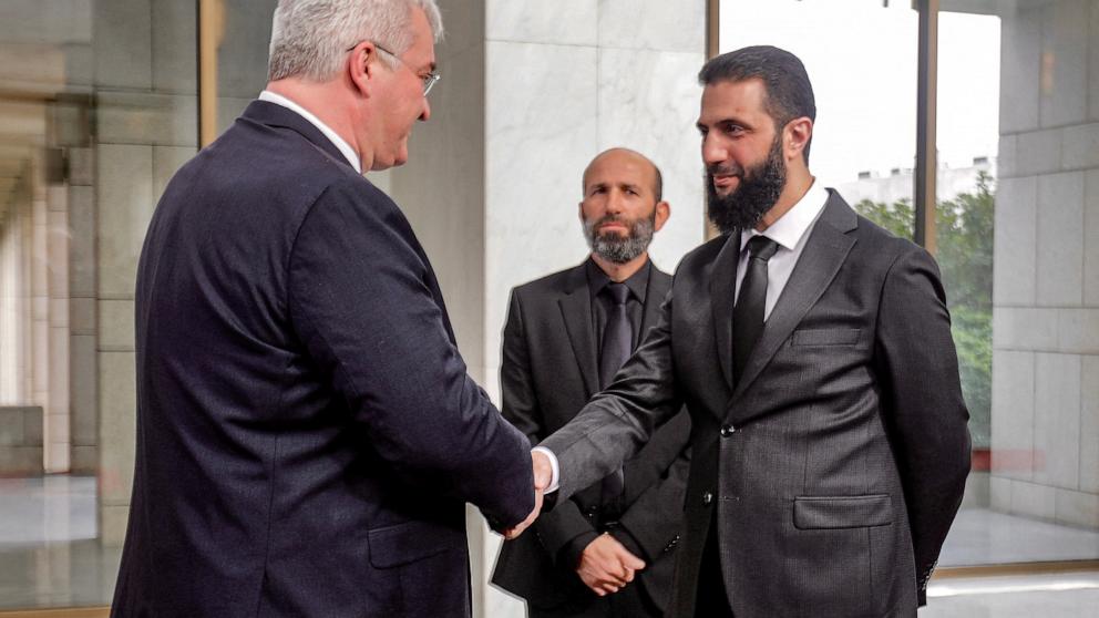 PHOTO: Syrian leader Ahmed al-Sharaa (R) receives Ukraine's Foreign Minister Andrii Sybiha in Damascus, Syria, on Dec. 30, 2024.