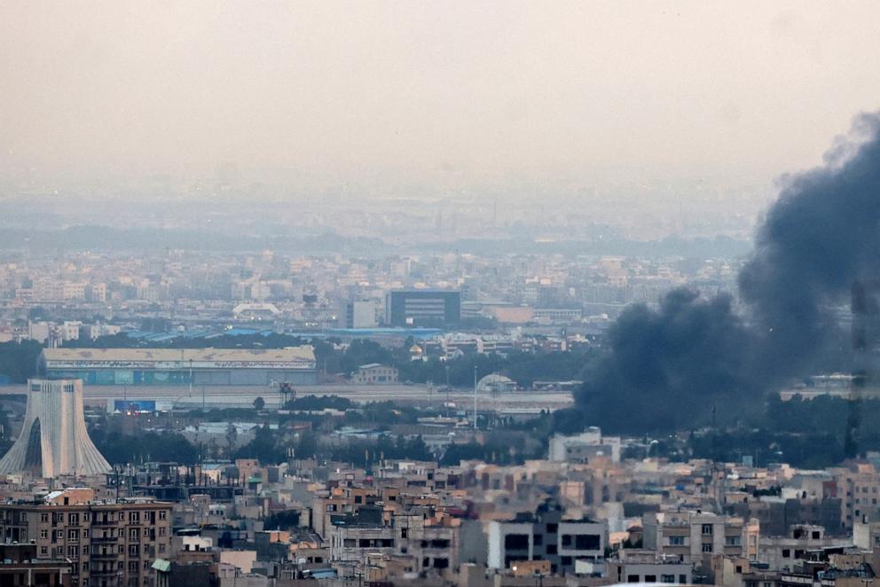 PHOTO: Smoke billows from a site near the Azadi Tower in central Tehran on June 16, 2025.