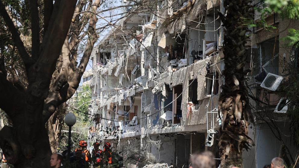 PHOTO: Israeli security forces and first responders gather at the site of an Iranian strike that hit a residential building in the Ramat Aviv area in Tel Aviv on June 22, 2025.