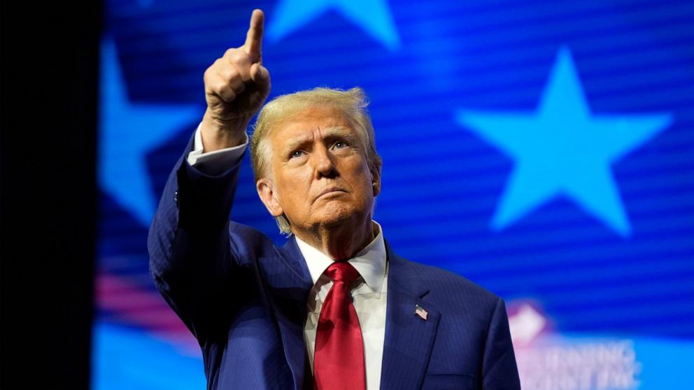 PHOTO: Republican presidential nominee former President Donald Trump gestures at a campaign rally, Oct. 23, 2024, in Duluth, Ga.