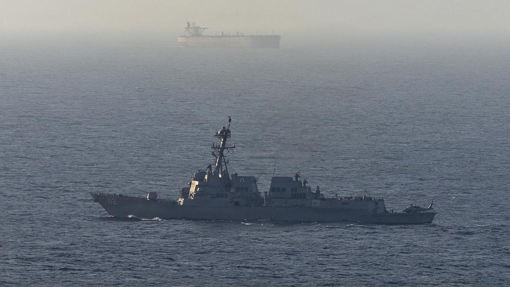 PHOTO: This U.S. Navy handout photograph released on April 21, 2026, by U.S. Central Command Public Affairs shows Arleigh Burke-class guided-missile destroyer USS Michael Murphy patrolling the Arabian Sea during a maritime blockade on April 15, 2026.
