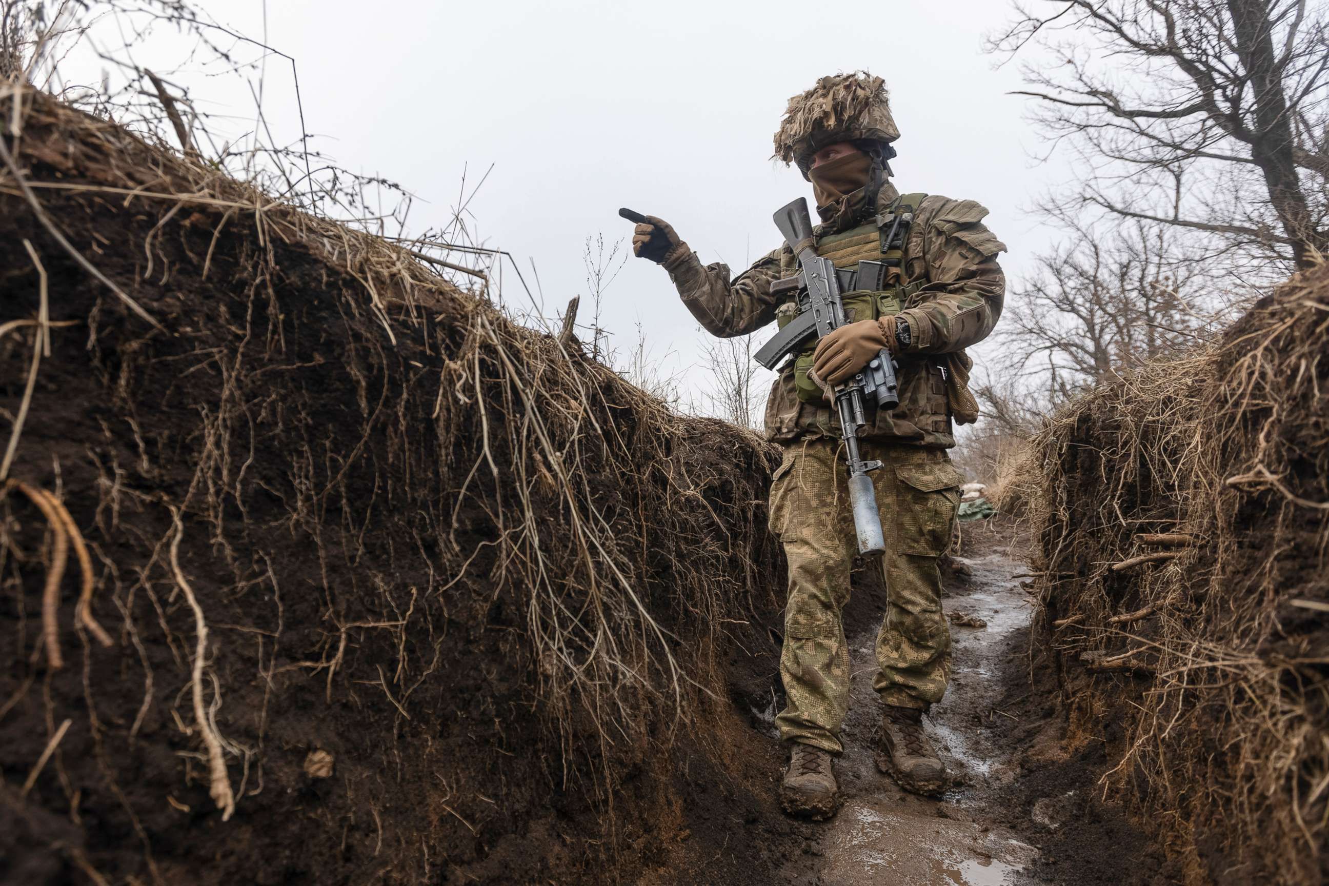 PHOTO: A Ukrainian soldier walks in a trench at the line of separation from pro-Russian rebels, Donetsk region, Ukraine, Jan. 10, 2022. 