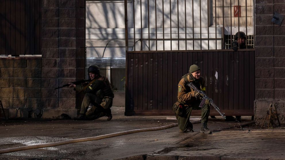 PHOTO: Ukrainian soldiers take positions outside a military facility after an explosion in Kyiv, Ukraine, Feb. 26, 2022.