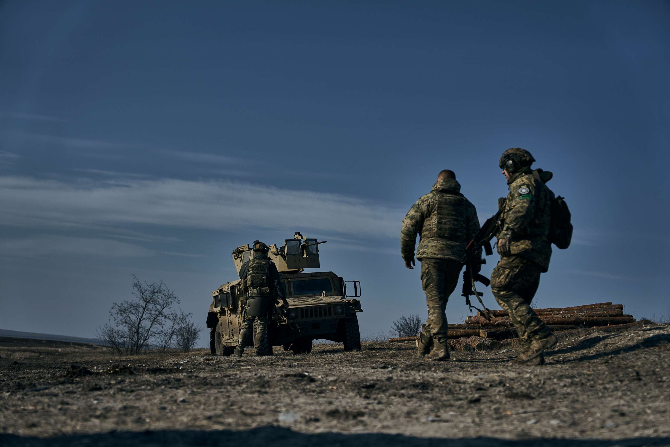 PHOTO: Soldiers of the Ukrainian 3rd Army Assault Brigade of the Special Operations Forces (SSO) "Azov" approach their armoured U.S. Hummer vehicle in position near Bakhmut, Donetsk region, Ukraine, Saturday, Feb. 11, 2023.
