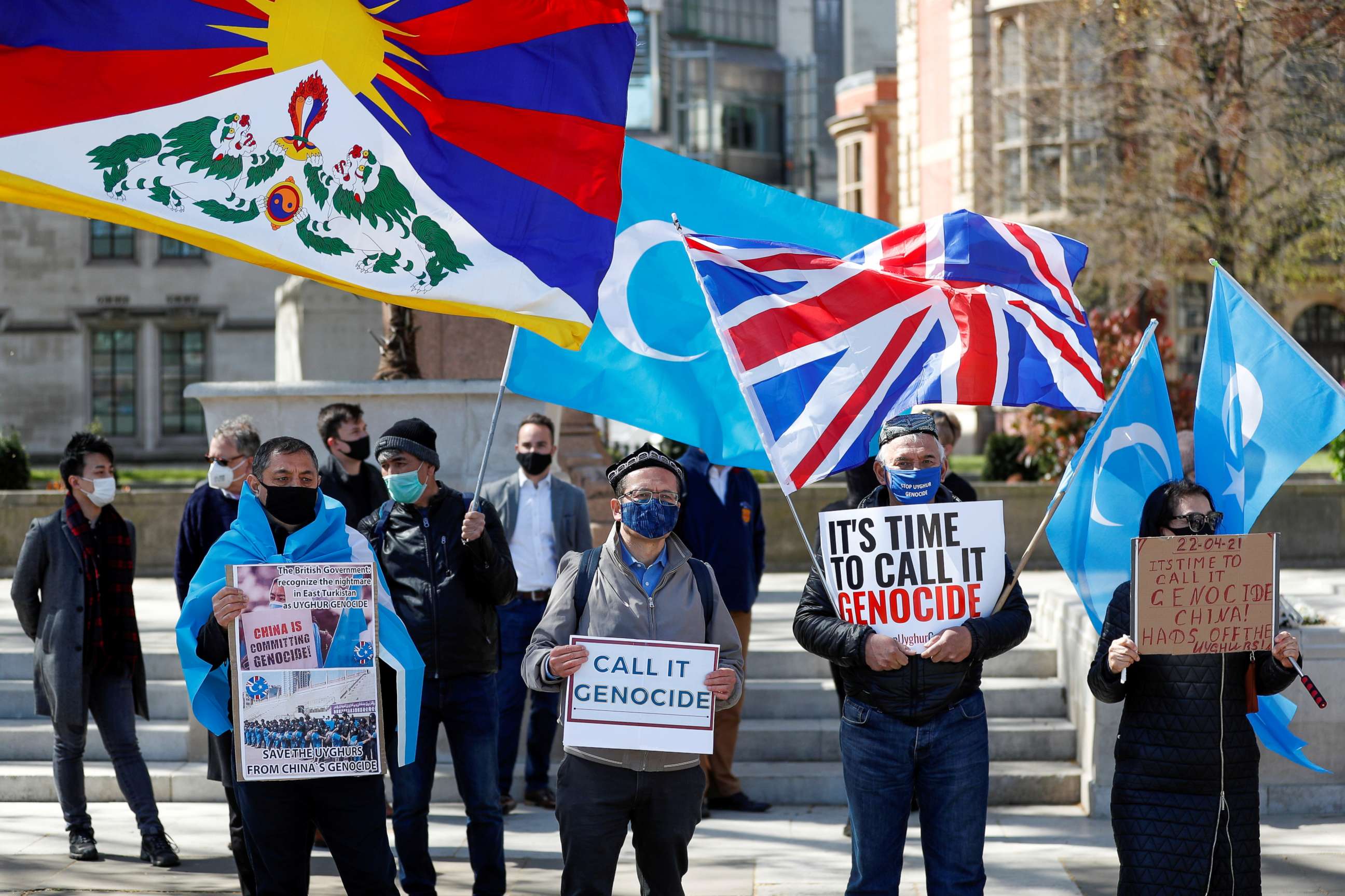 FILE PHOTO: Demonstrators hold placards during a protest against Uyghur genocide, in London, Britain April 22, 2021.