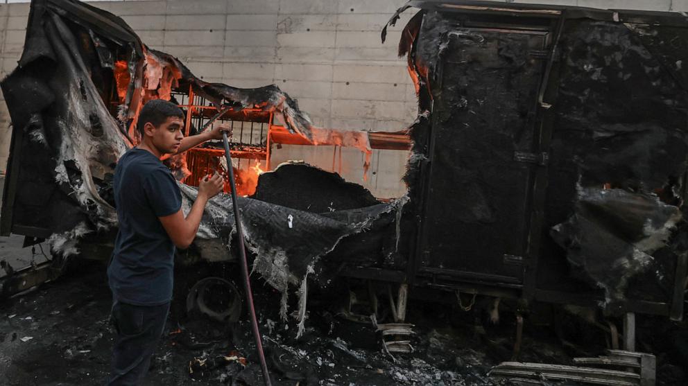 PHOTO: A Palestinian man tries to extinguish flames from a burning truck after Israeli settlers attacked the village of Beit Lid, east of Tulkarm in the occupied West Bank on Nov. 11, 2025.