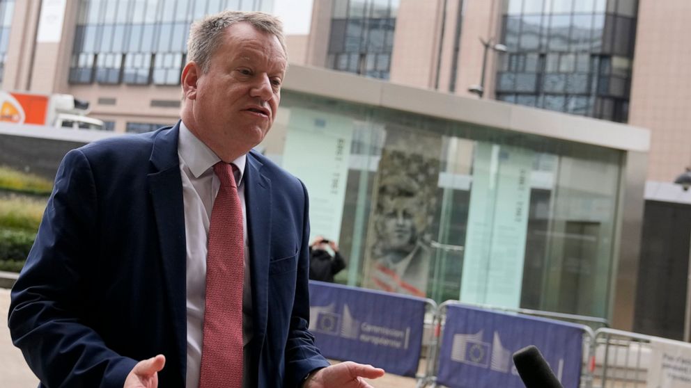 United Kingdom's Brexit negotiator Lord David Frost speaks with the media as he arrives for a lunch with European Commissioner for Inter-institutional Relations and Foresight Maros Sefcovic at EU headquarters in Brussels, Friday, Oct. 15, 2021. Brexi