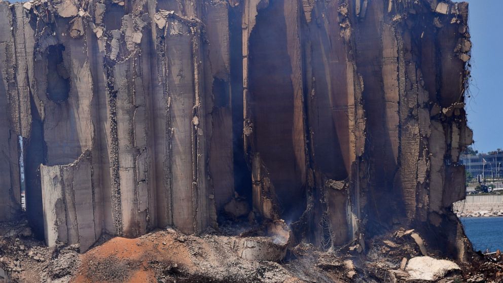 Smoke rises from the north block silos which were damaged during the August 2020 massive explosion in the port, in Beirut, Lebanon, Thursday, July 28, 2022. Emmanuel Durand, a French civil engineer who volunteered for the Lebanese government-commissi