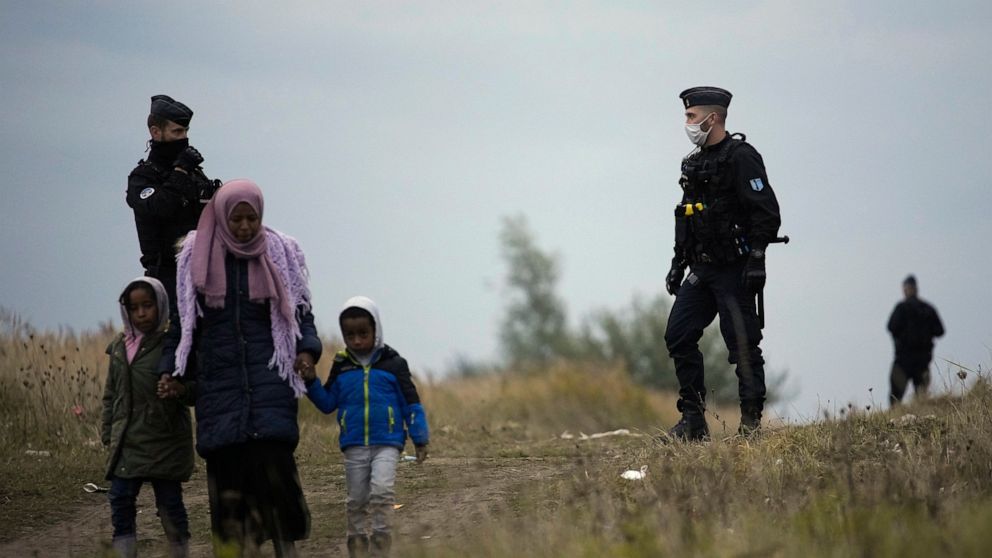 French police evacuate migrants from makeshift camp