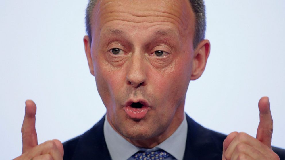 FILE - Party member Friedrich Merz addresses the delegates during a Christian Democratic Union party convention in Leipzig, Germany, Friday, Nov. 22, 2019. The conservative one-time rival of Chancellor Angela Merkel has joined the race to become the 