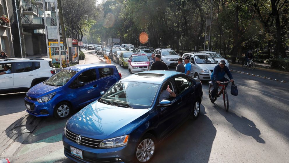 Vehicles stand in line to fill up their fuel tanks at a gas station in Mexico, City, Wednesday, Jan. 9, 2019. A fuel scarcity arose after President Andres Manuel Lopez Obrador decided to close government pipelines riddled with illegal fuel taps drill